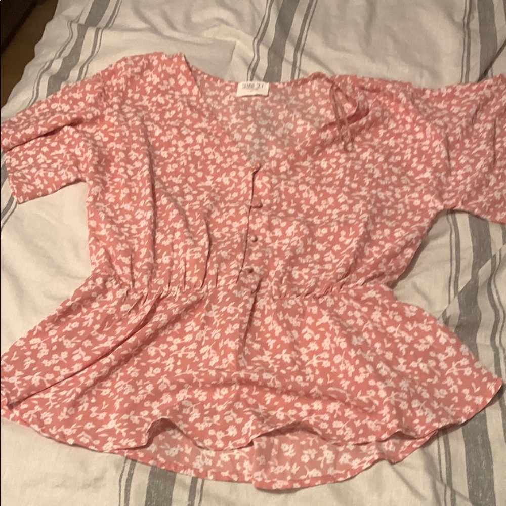 Pink and white floral peplum blouse